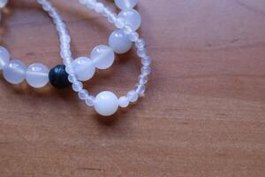 Necklace and bracelet from chalcedony and agate stone. The jewellery from minerals. photo