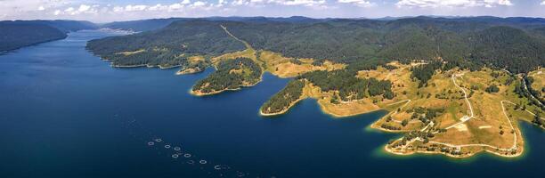 Stunning aerial panorama view of the lake coastline, Dospat, Bulgaria photo
