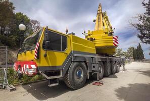 Mobile crane at construction site heavy truck big photo