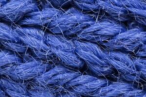 The macro texture of the blue cotton fiber cloth. photo