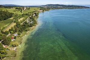 Aerial view from a drone of the beautiful coastline of Bodensee lake photo
