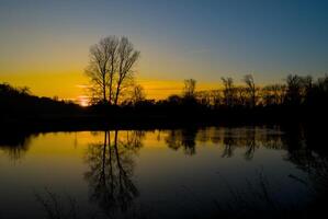 Beautiful autumn sunset on river labe photo