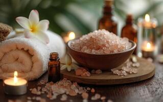 AI generated A peaceful spa display featuring crystals of Himalayan salt, essential oils, delicate frangipani flowers, and candles photo