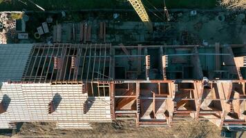 Aerial top view Construction of a cottage house. Builders build a house from bricks. video