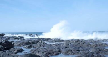 an ocean wave crash the rocks on the shore video