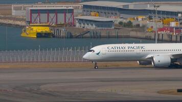 HONG KONG - NOVEMBER 10, 2019. Airbus A350-941, B-LQA of Cathay Pacific taxiing on the runway at Chek Lap Kok Airport. Cathay Pacific Hong Kong airline video