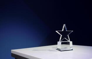 Star-shaped award on a table with spotlights and copy space photo