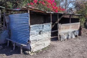 Old abandoned huts on the side of African roads in poor regions. Lost Places. photo