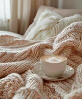 AI generated a blanket and cup of coffee on a bed photo