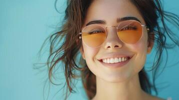 AI generated A close-up photo capturing a fashionable young woman in sunglasses smiling against a blue backdrop