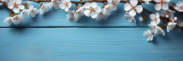 AI generated cherry blossom on a blue wooden table background. photo