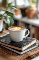 AI generated coffe on black notebook with laptop on an office desk photo