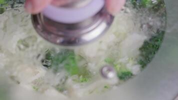 caucasian hand opens glass lid from pot with boiling broccoli and cauliflower video