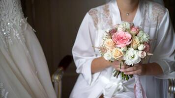 Bride with bouquet, closeup. Bride holding bridal bouquet. photo