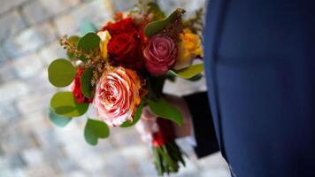 Beautiful bridal bouquet. wedding bouquet at bride's hands photo