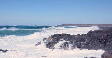 an ocean wave crash the rocks on the shore video