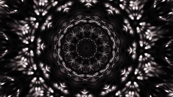 Black and white photo of circular object with circular design. Kaleidoscope VJ loop video
