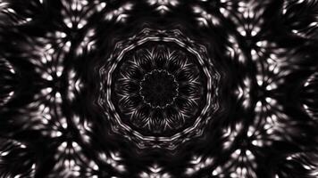 Black and white photo of circular object with circular design. Kaleidoscope VJ loop video