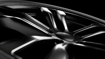 Spinning car wheel on black background. Loop animation video