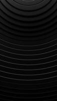 Black background with circular pattern of lines and white circle. Vertical looped animation video