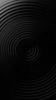 Black and white photo of circular object with black background. Vertical looped animation video