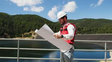 Landscape architect work near the dam for the redevelopment of green spaces video