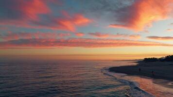 Calm Waves Of Ocean Under Red Sunset video