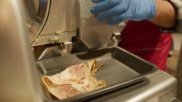 Cutting pork meat with a slicer in Calabrian Tropea traditional city party video