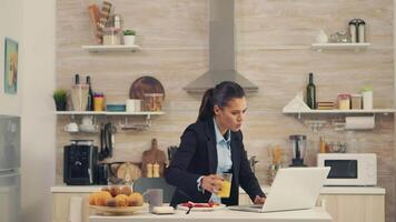 Freelancer woman late at the office while eating breakfast. Young freelancer working around the clock to meet her goals, stressful way of life, hurry, late for work, always on the run video