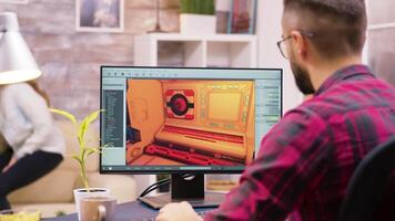 stänga upp skott av spel utvecklare arbetssätt på en ny nivå av spel i hans Hem kontor video