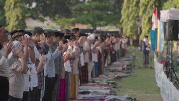 Denpasar, Indonesia, circa 2023 - Thousand of Muslim Muslims Gather Celebrate Islam Eid al-Fitr Salah Praying in a Park in Denpasar City Bali, Indonesia video