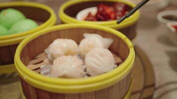 Variety of Steamed Chinese Dim Sum Food and Chopsticks video