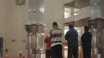 Jakarta, Indonesia, August 9, 2023 - Indonesian Muslim People Salah Salat Praying in Istiqlal Mosque video