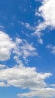 Beautiful transforming cloudscape in the bright blue sky. Fantastic timelapse on summer daytime. Vertical video