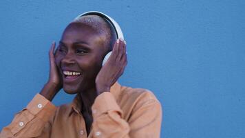 a woman wearing wireless headphones video