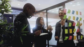 Multiracial business team working together in a boardroom of modern office video