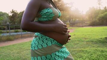 a pregnant woman in a green dress video