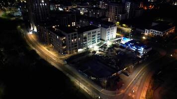 hora lapso aéreo ver de iluminado central watford ciudad de Inglaterra Reino Unido a noche. marzo tercero, 2024 video