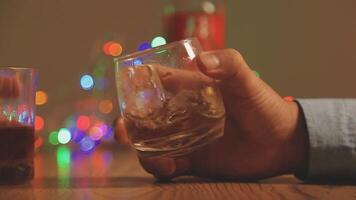 Close up of two people are cheering with cocktails in a bar or disco club. video