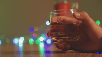 Close up of two people are cheering with cocktails in a bar or disco club. video