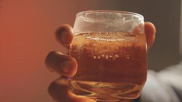 Close up of two people are cheering with cocktails in a bar or disco club. video