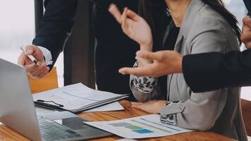 Business team meeting present, investor colleagues consultation and conference new strategy plan business and market growth on financial document graph report, Meeting and Talking. video