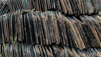 unused roof tiles, old roof tiles, pattern tiles, rows of roof tiles in a row, background texture photo