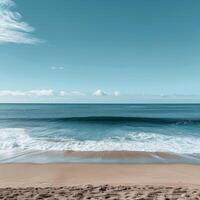 ai generado claro azul cielo terminado un pacífico playa con amable olas Lavado sobre el arenoso costa, invocando un sentido de calma foto