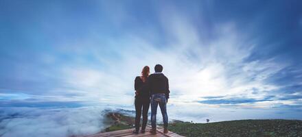 Lover Men and women Asia travel relax. Morning atmosphere nature Forests, mountains. Phu Thap Buek Thailand photo