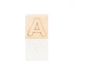 Wooden cubes with letters on a white background photo