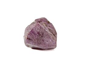 macro mineral stone alexandrite red - violet in daylight on a white photo