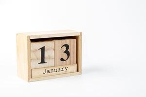 de madera calendario enero 13 en un blanco antecedentes foto