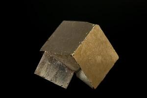 macro mineral pyrite stone on a black background photo