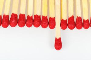 matches with a red head on a white background photo